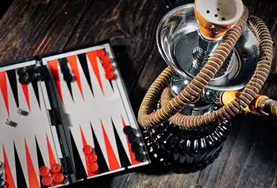 Tabletop hookah with board game on table